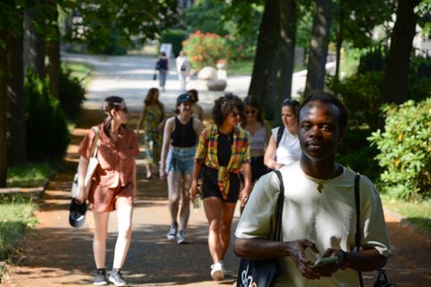 A Decolonial Tours group walking through a park